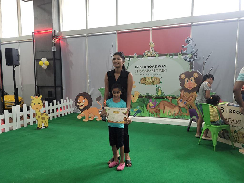 Trehan IRIS Broadway Summer Camp – Another kid showing the Certificate of Participation